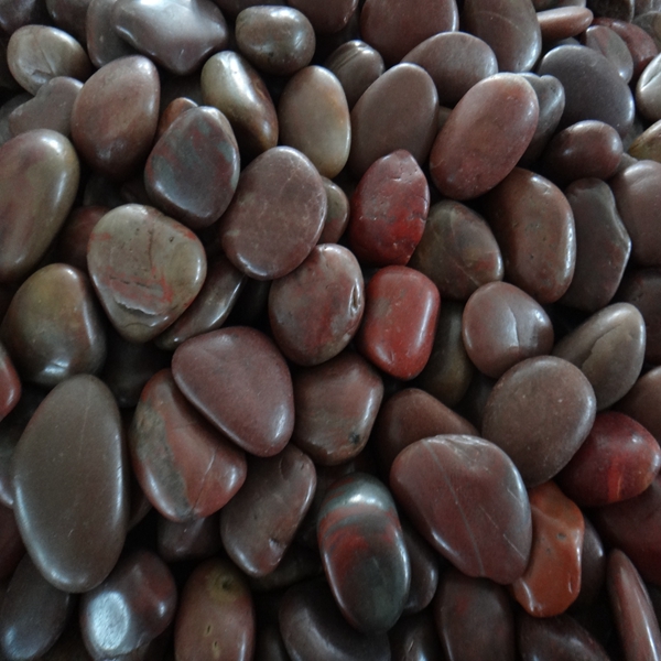 Red polished stone pebble